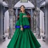 Green pure cotton Navratri chaniya choli with gota striped peplum top and kutchi work purse