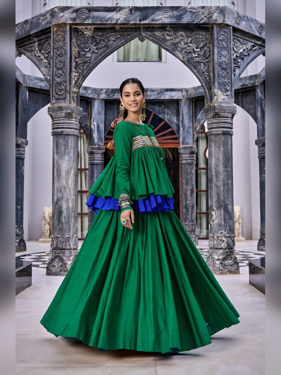 Green pure cotton Navratri chaniya choli with gota striped peplum top and kutchi work purse
