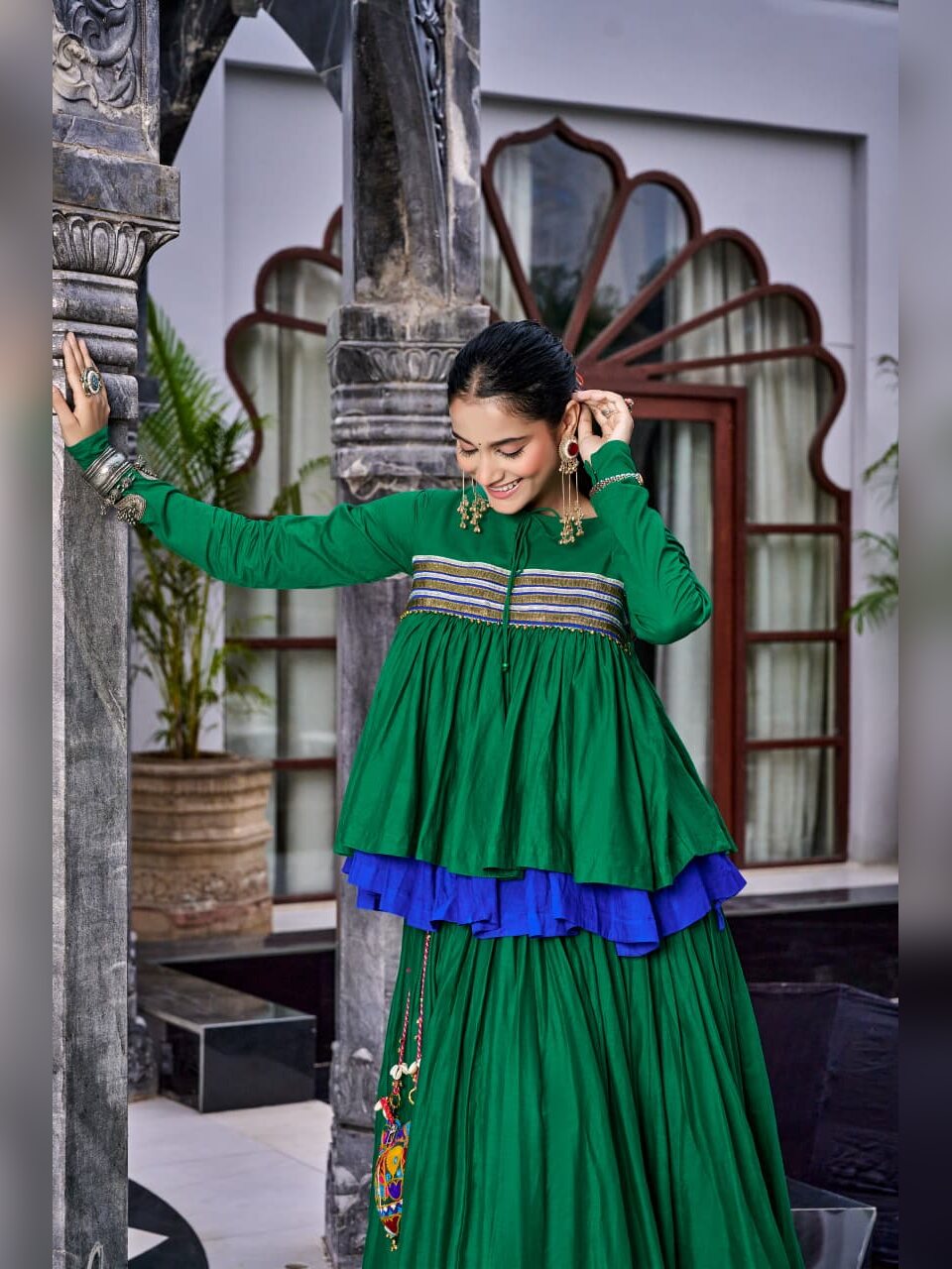 Gota striped yoke and tassel tie on the green Chhabili peplum top