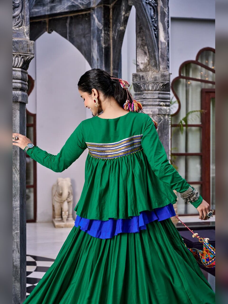 Back view of the green Chhabili peplum top showing the gota striped band