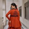 Back view of the rust Chhabili peplum top with navy Kashida embroidery