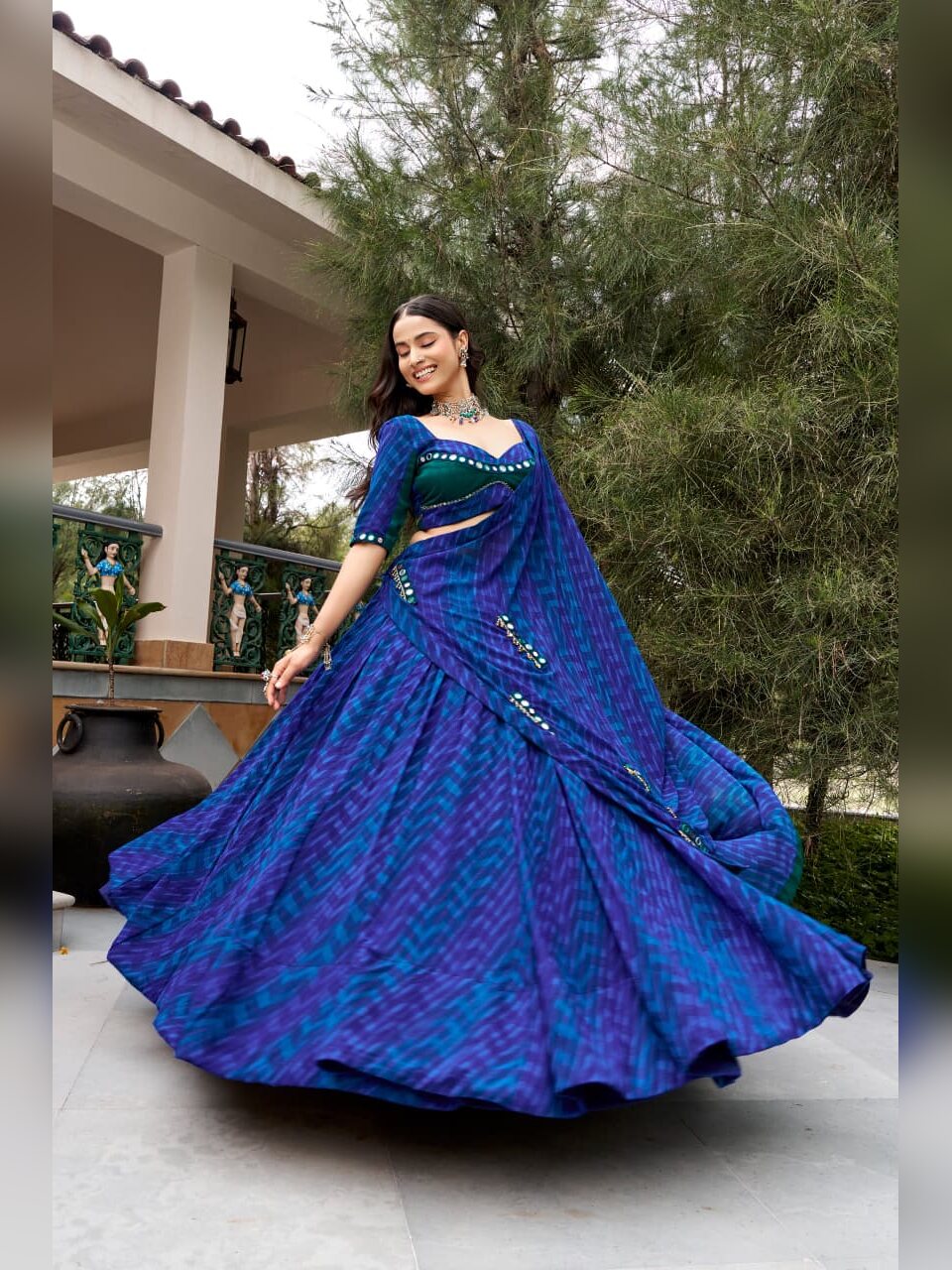 Blue leheriya georgette lehenga opening into an eight metre flair