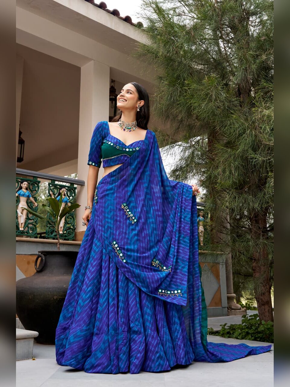 Full length view of the blue leheriya lehenga with the dupatta draped and trailing