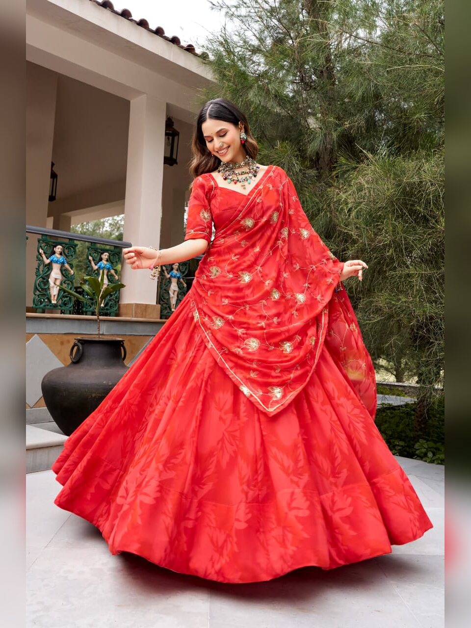 Red georgette Navratri chaniya choli with gold sequin and thread embroidery on the dupatta