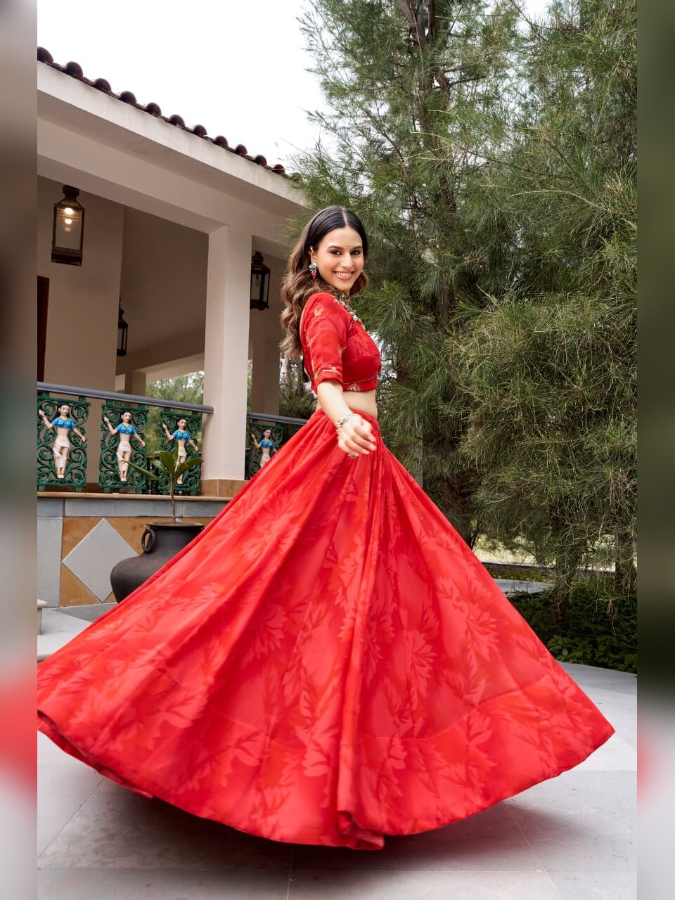 Red georgette lehenga with tonal leaf print opening on a turn