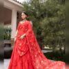Full length view of the red Morbani lehenga with the embroidered dupatta trailing