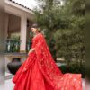 Red sheer dupatta with gold floral vine embroidery over the red georgette lehenga